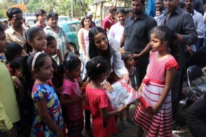 Poonam Pandey Distribute Raincoats To Street Children