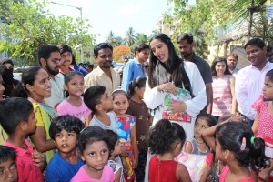 Poonam Pandey Distribute Raincoats To Street Children