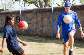 Australian team plays football with underprivileged girls
