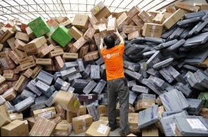 China company replaces workers with robots to sort packages