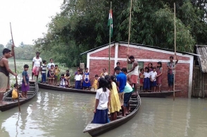 Photos of Assam schools hoisting national flag during flood go viral