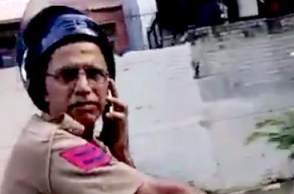 Watch: Cop talks on phone while riding bike; slaps man who questioned him