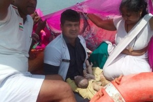 Woman delivers baby in rescue boat