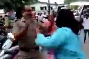 Woman slaps police in broad daylight