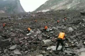 Over 140 people feared buried in a landslide