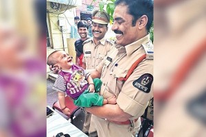 Touching photo of police officer with rescued infant goes viral