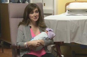 Doctor takes break from giving birth to deliver another baby