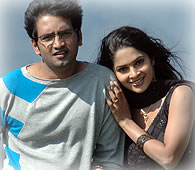 http://www.behindwoods.com/tamil-movie-reviews/reviews-1/images-1/santhanam.jpg