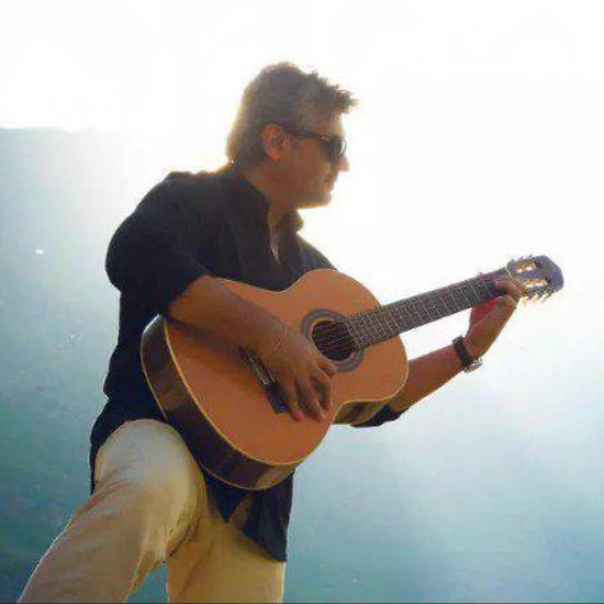 Ajith Kumar plays the guitar
