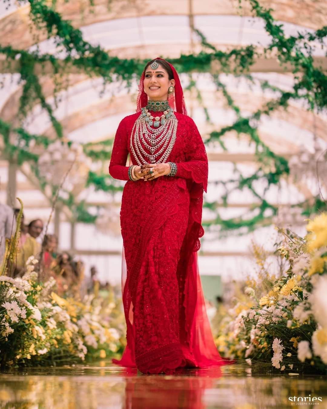 DETAILS OF VIGNESH SHIVAN'S OUTFIT AND NAYANTHARA RED SAREE