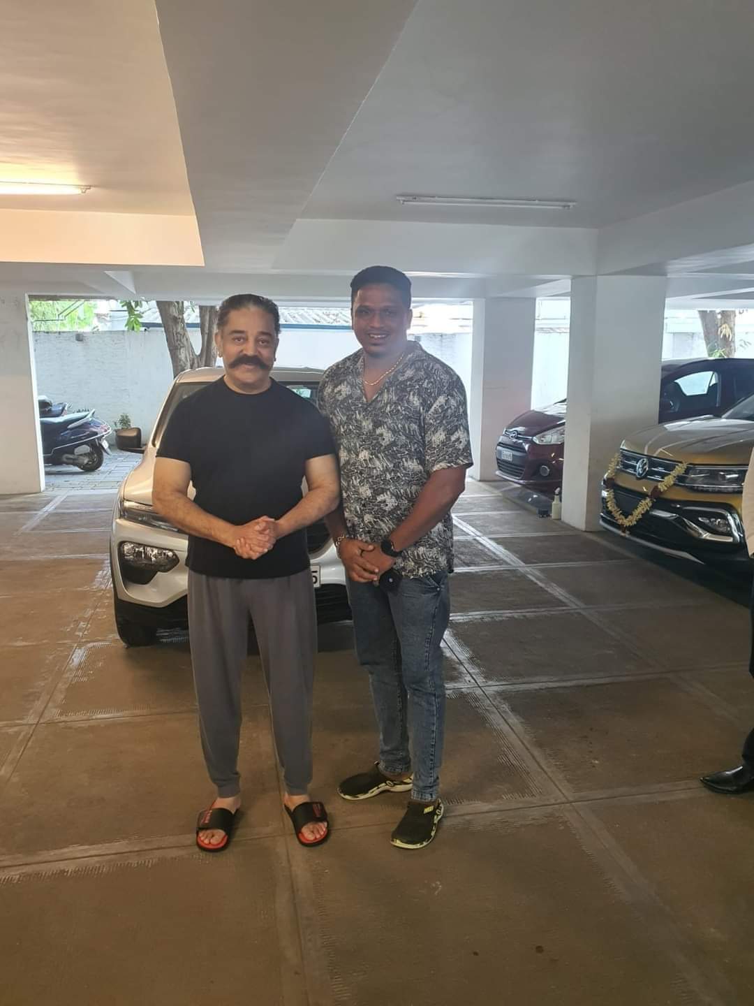 Kamal Hassan with his fitness trainer Olympia Suri