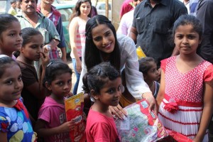 Poonam Pandey Distribute Raincoats To Street Children