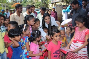 Poonam Pandey Distribute Raincoats To Street Children