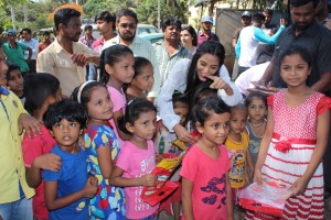 Poonam Pandey Distribute Raincoats To Street Children
