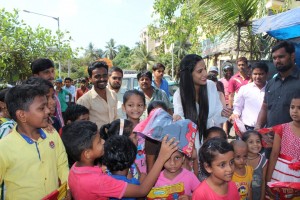 Poonam Pandey Distribute Raincoats To Street Children