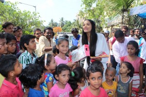 Poonam Pandey Distribute Raincoats To Street Children