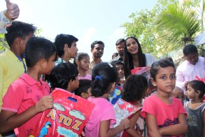 Poonam Pandey Distribute Raincoats To Street Children