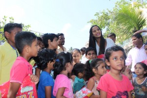 Poonam Pandey Distribute Raincoats To Street Children