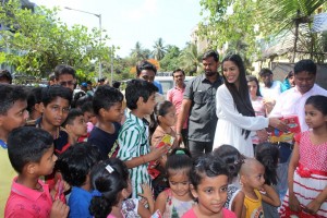 Poonam Pandey Distribute Raincoats To Street Children
