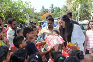 Poonam Pandey Distribute Raincoats To Street Children