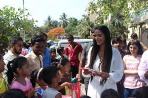 Poonam Pandey Distribute Raincoats To Street Children