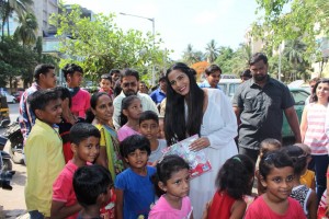 Poonam Pandey Distribute Raincoats To Street Children