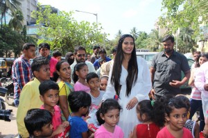Poonam Pandey Distribute Raincoats To Street Children