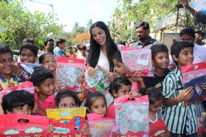 Poonam Pandey Distribute Raincoats To Street Children