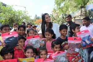 Poonam Pandey Distribute Raincoats To Street Children