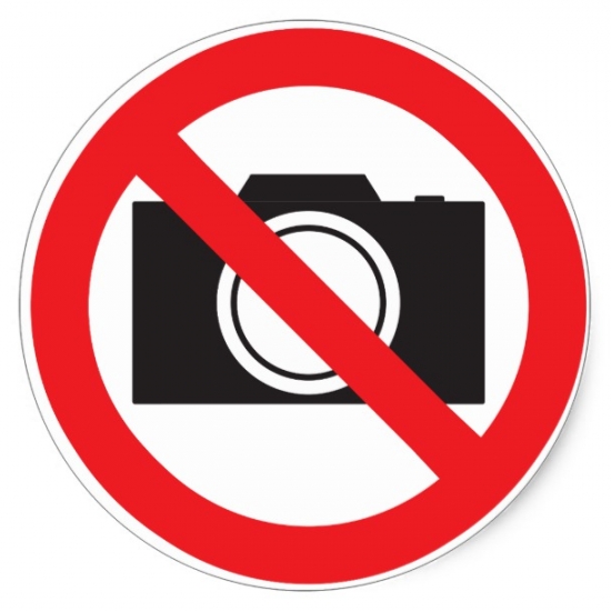 Items that are banned include cameras, mobiles, handbags, bottles, cans, and tins