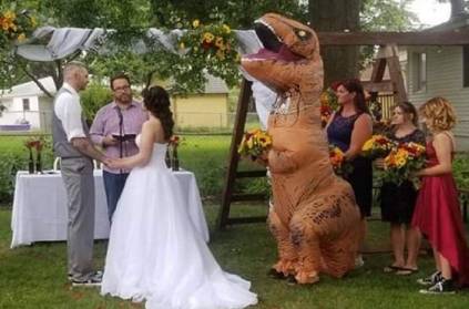 Dinosaur bridesmaid attends the wedding - says bride gave permission