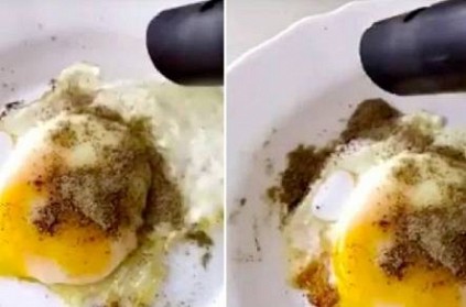 man uses vacuum cleaner to remove extra pepper from egg video
