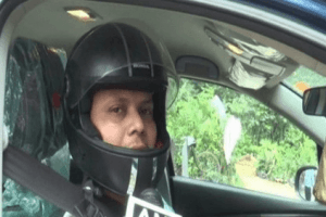 Bizarre: Man Wears Helmet While Driving Car; Gives Unusual Reason!