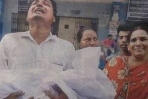 Inconsolable father cries holding newborn's body as doctors' continue protest: Grieving Photos Inside!