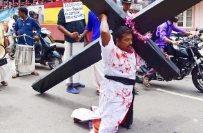 Father carries cross to seek justice for his dead daughter