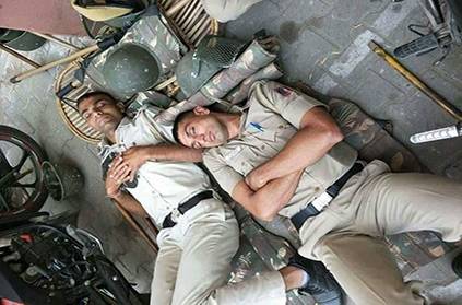 Heartbreaking Image of Policemen sleeping on the road goes viral