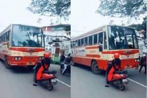 Girl Power: Woman on Tiny Two Wheeler Dares Moving Bus; Teaches Driver a Lesson | Video