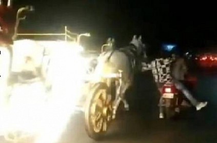 Men on bike stops out of control horse carriage in Pune Video