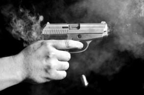 Teacher shot outside school, caught on CCTV