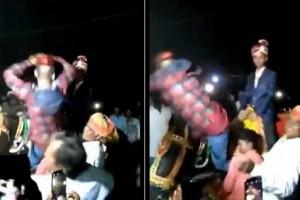 Watch man doing "vera level" snake dance on groom's horse