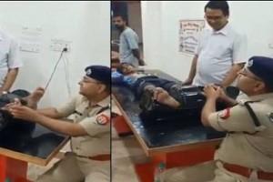 Watch Video: Superintendent of Police gives foot massage to devotee, says "it's serving people"