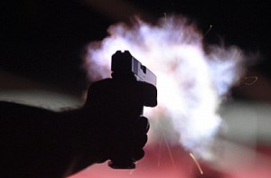 Woman shot twice in front of her husband and child