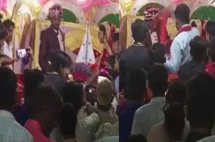Bride slaps groom twice on stage as he tries to garland her