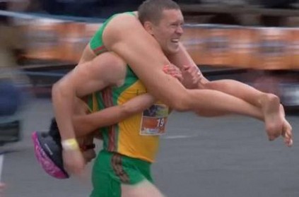 Couple Defends World Wife-Carrying Championship Title