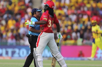 Chris Gayle chest Pump with Umpire