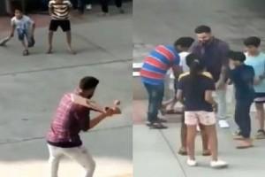 Kohli plays street cricket with children, runs away with bat - Watch Video