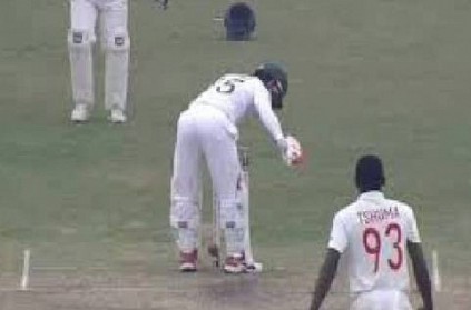 Mushfiqur Rahim shields the stumps awkwardly with his rear side 