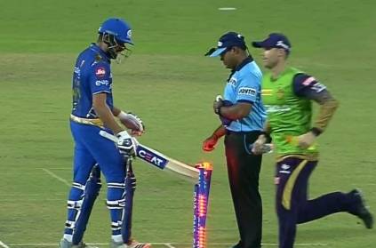 Rohit Sharma hits the stumps with the bat after getting out LBW