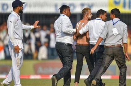 Virat Kohli fan sneaks onto field during Indore Test : video