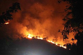 தேனி 'காட்டுத் தீ': ஒருவர் சடலமாக மீட்பு